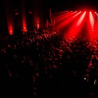 Cheering,Stage,Crowd.,Bright,Red,Screen,Behind,The,Stage.